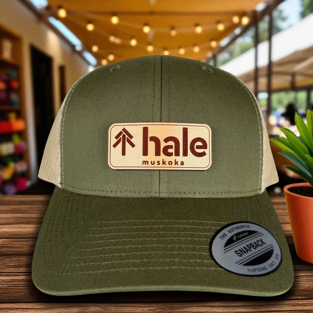Finished trucker hat with an engraved leather patch
